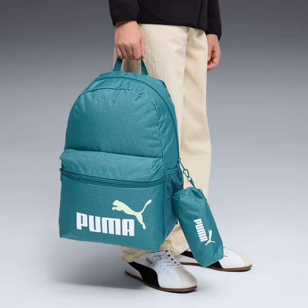 PUMA PHASE BACKPACK BAG SET - Emerald Ice, lifestyle view held by model with matching pouch